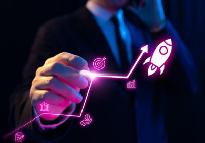 Business professional pointing at glowing growth chart with document and funding icons representing startup due diligence process in Pakistan